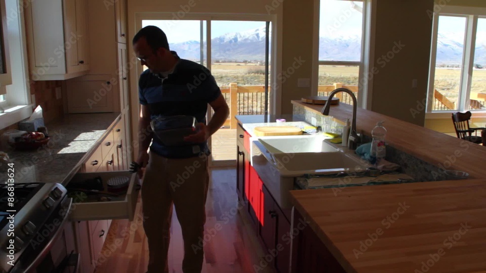 Man Cleans Kitchen Man Cleans Kitchen