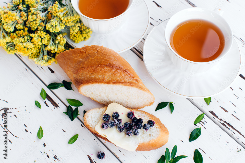 Diet breakfast with Herbal tea and bread with butter and blueberries Diet breakfast with Herbal tea and bread with butter and blueberries