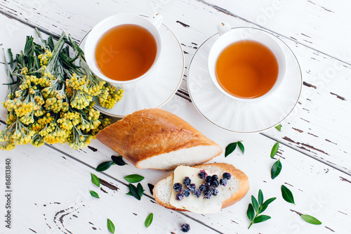 Diet breakfast with Herbal tea and bread with butter and blueberries