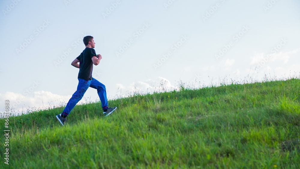 Wide Shot Young Man Running in Nature Wide Shot Young Man Running in Nature