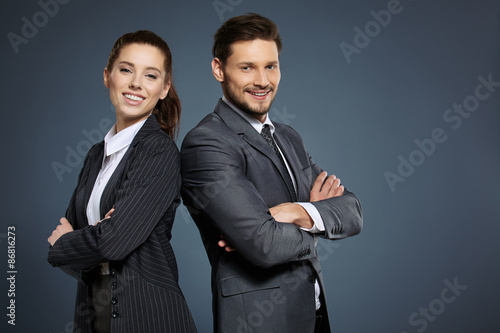 Business couple on blue background