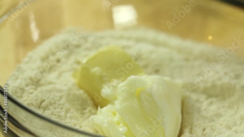 woman putting butter in pie crust photo