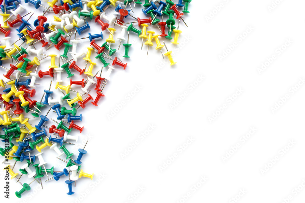 Colorful pins on white background