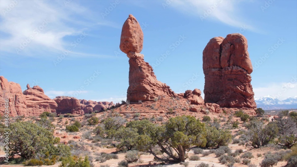 People by the balancing rock in Arches National Park Utah People by the balancing rock in Arches National Park Utah