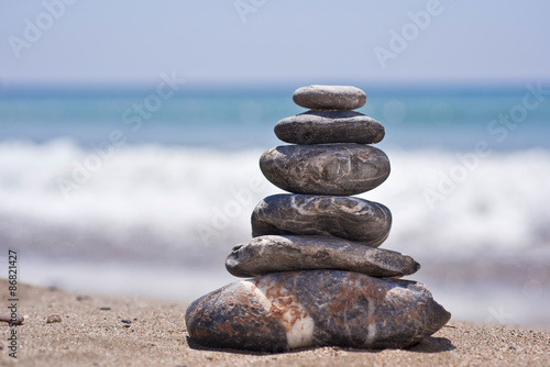 Stack of pebbles on beach. Natural background