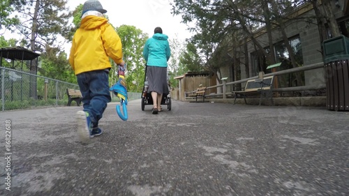 Gimbal shot of a family at the Hogle zoo on a rainy day photo