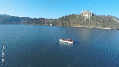 Wallpaper Mural Fly around a boat on lake Bled with castle in Torontodigital.ca