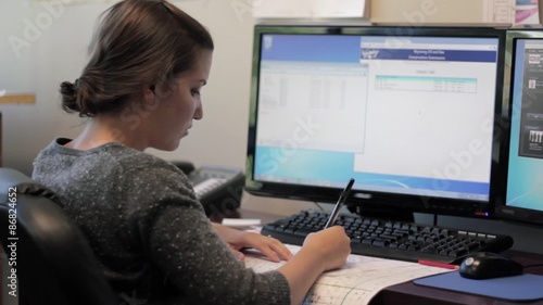Woman working in officespace on computer