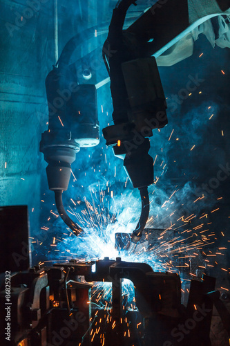robots welding in a car factory