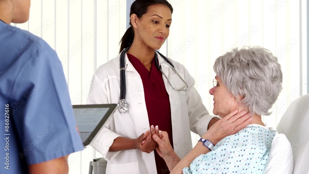 African American doctor talking to mature woman patient African American doctor talking to mature woman patient