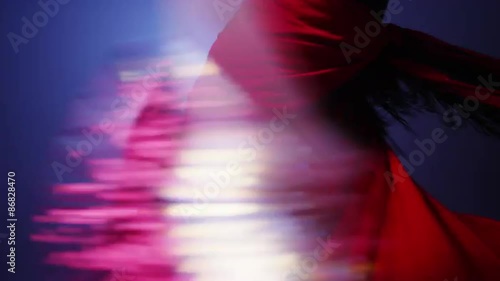 Mixed race flamenco dancer twirling in costume