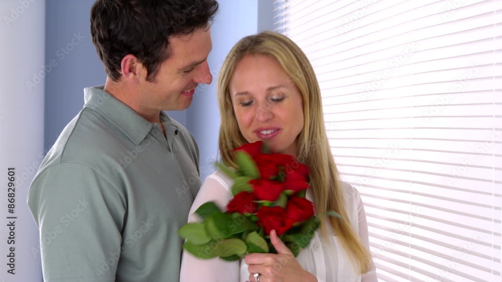Sweet husband surprises his wife with flowers Sweet husband surprises his wife with flowers