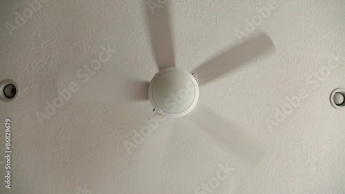 a spinning ceiling fan low shot