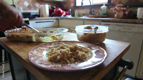 A man eating leftovers