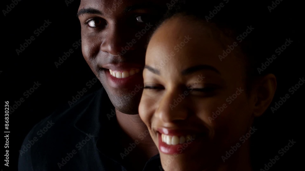 Dramatic rack focus between smiling young black man and woman Dramatic rack focus between smiling young black man and woman