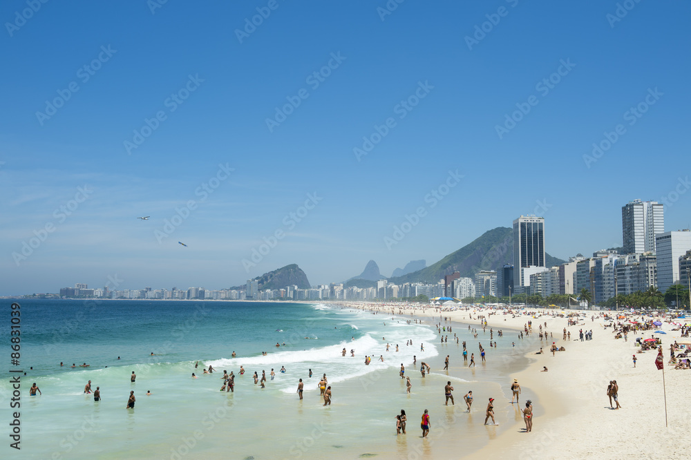 Scenic view of Copacabana Beach shore with skyline of Rio de Janeiro Brazil Scenic view of Copacabana Beach shore with skyline of Rio de Janeiro Brazil