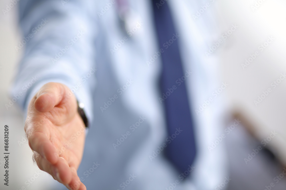 Portrait of businessman giving hand for handshake Portrait of businessman giving hand for handshake