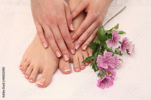 Fototapeta Naklejka Na Ścianę i Meble -  Beautiful feet with perfect spa french nail pedicure