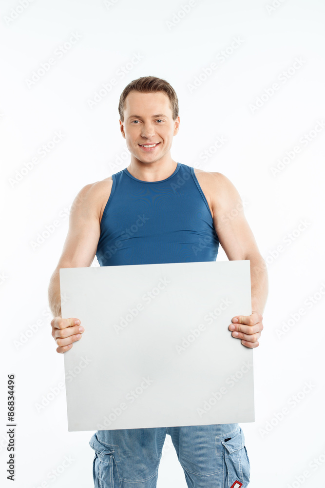 Handsome young man is presenting empty blank Handsome young man is presenting empty blank