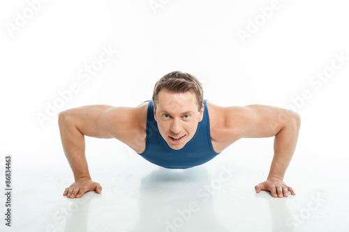 Handsome young male athlete is working out