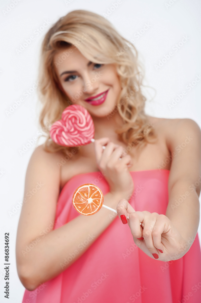 Attractive young woman with two sweet candies Attractive young woman with two sweet candies