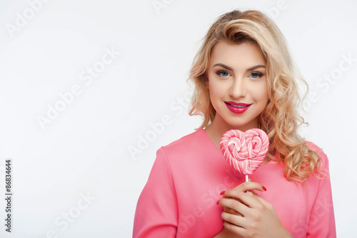 Beautiful young woman with sweet colored candy © Yakobchuk Olena