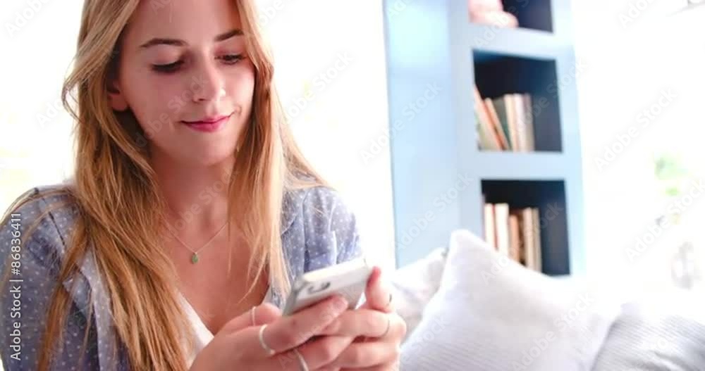Woman Sitting On Couch In Home Office Using Mobile Phone Woman Sitting On Couch In Home Office Using Mobile Phone