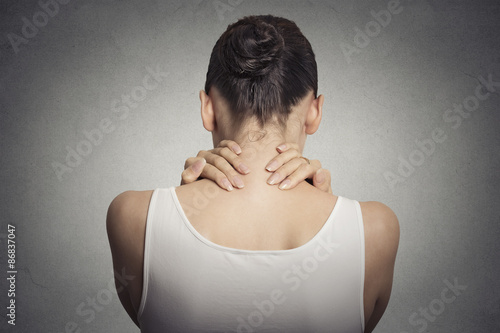 Obraz na plátne tired female massaging her painful neck