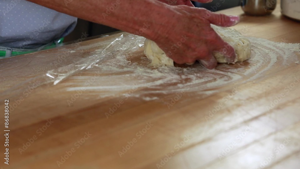 a woman making a fresh loaf of bread in the kitchen a woman making a fresh loaf of bread in the kitchen