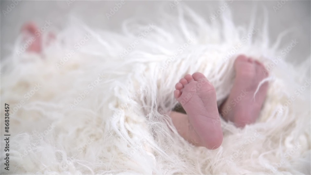 Newborn Baby Kicking under Soft Blanket in Slow Motion Newborn Baby Kicking under Soft Blanket in Slow Motion