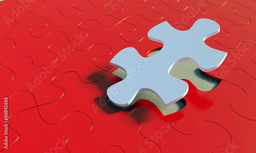 metal puzzle on red ground