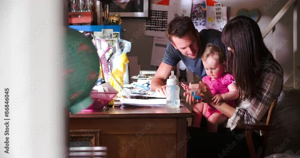 Couple With Young Daughter Running Business From Home Couple With Young Daughter Running Business From Home