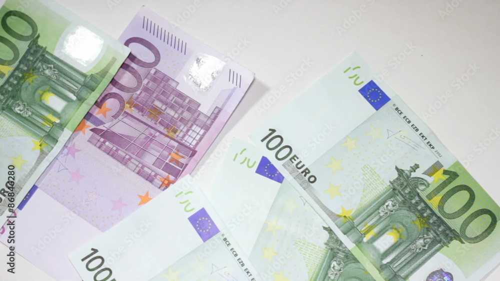 Throwing big Euro money on white table Throwing big Euro money on white table
