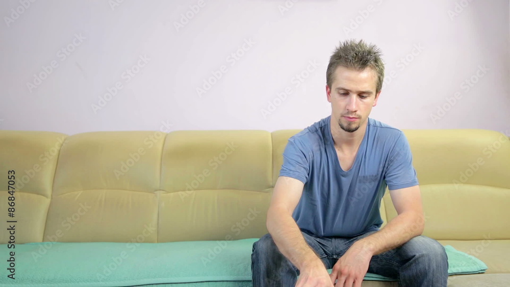 Man Picks up the phone while watching television Man Picks up the phone while watching television