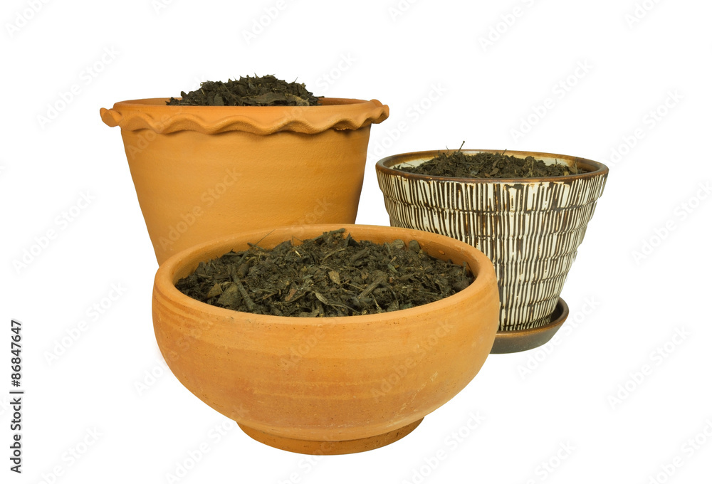 Flower pots with soil isolated on white Flower pots with soil isolated on white