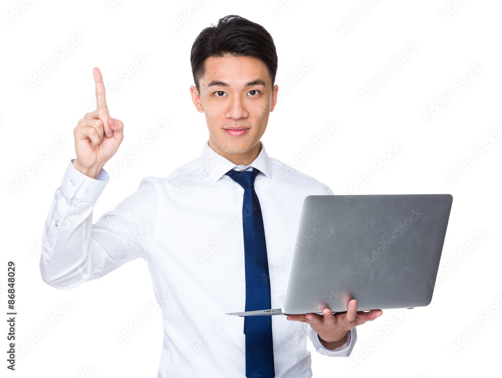 Young businessman hold with laptop computer and finger point up Young businessman hold with laptop computer and finger point up