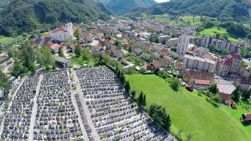 Graveyards tombstones and city in background photo