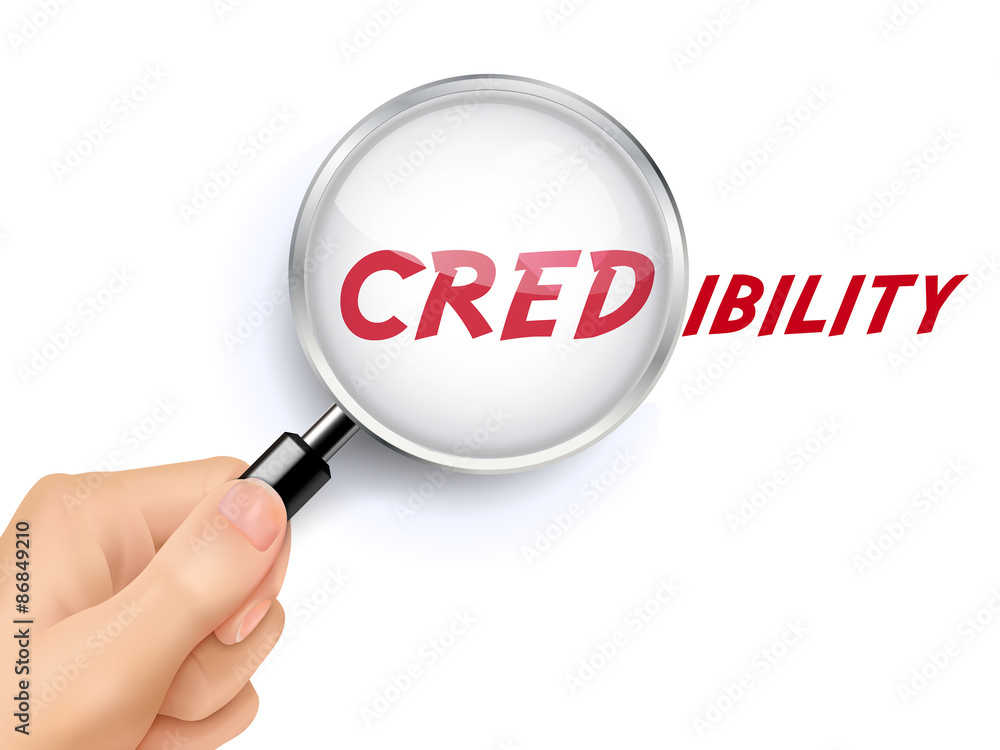 credibility word showing through magnifying glass credibility word showing through magnifying glass
