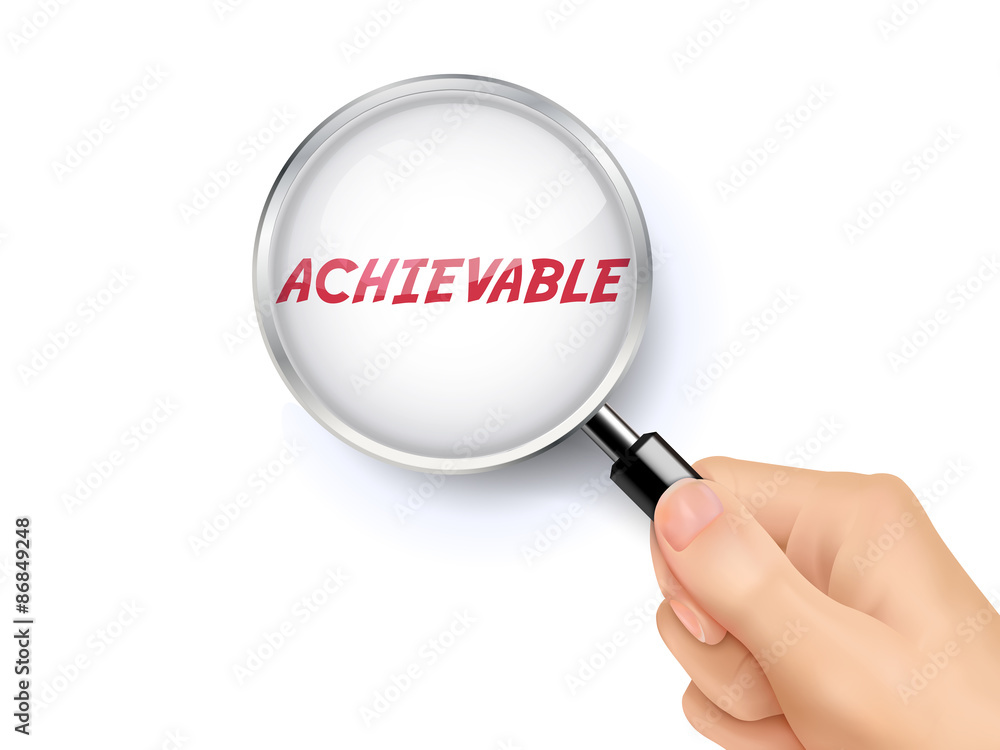 achievable word showing through magnifying glass achievable word showing through magnifying glass