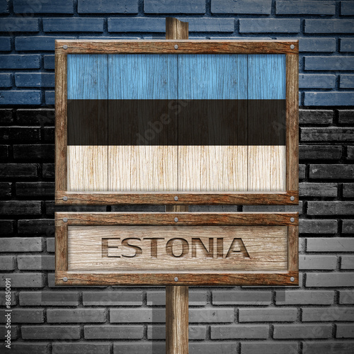 Estonia flag wooden sign with brickwall background
