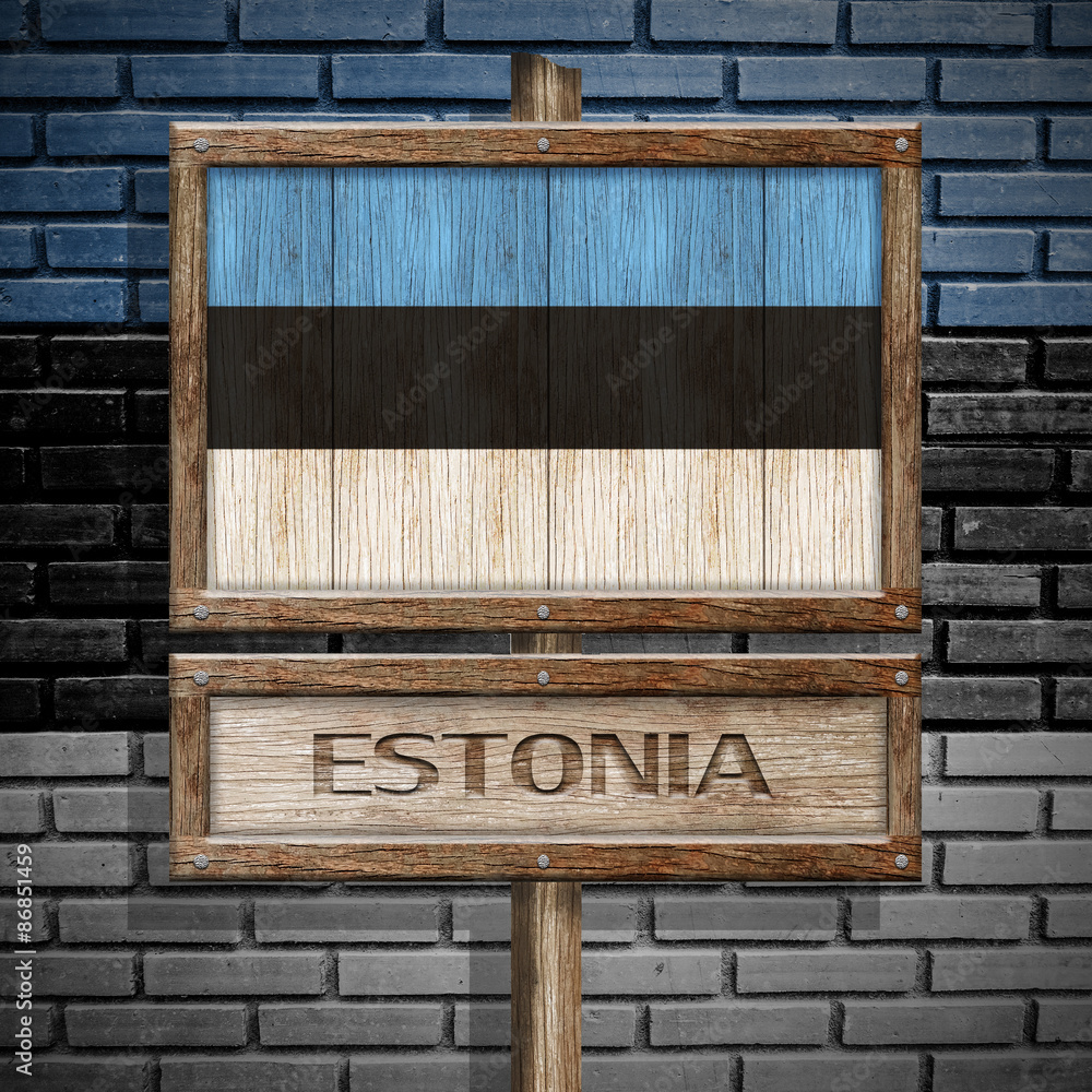 Fototapeta premium Estonia flag wooden sign with brickwall background