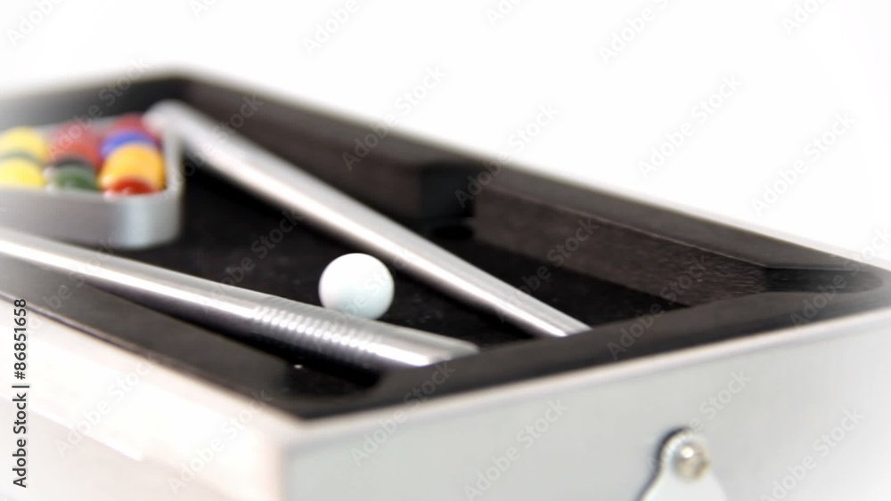 Sliding over a mini pool table on white background Sliding over a mini pool table on white background
