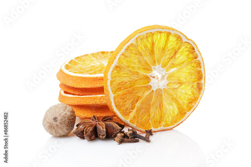Dried orange with spices on a white background