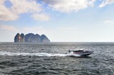 fast boat with mountain background in Phuket, Thailand