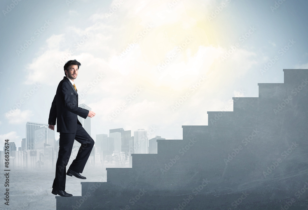 Businessman climbing up a concrete staircase concept Businessman climbing up a concrete staircase concept