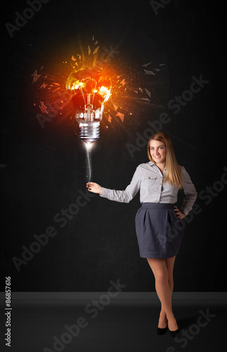 Businesswoman with an explosion bulb