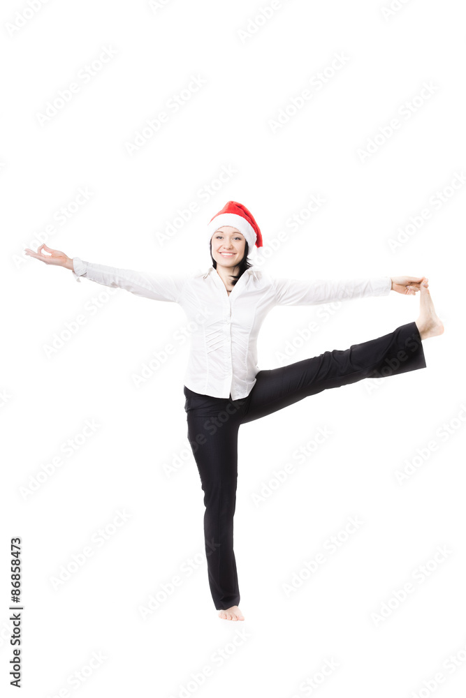 Young office woman in Big Toe yoga Pose in santa claus hat on wh