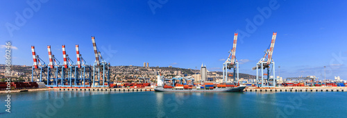 View of the city of Haifa Israel, from Haifa's Port with container ship and Carmel mountain in the background