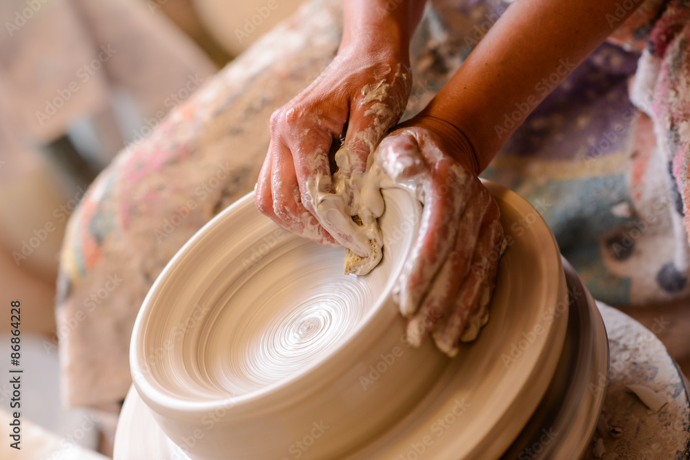 Woman potter hands crafts
