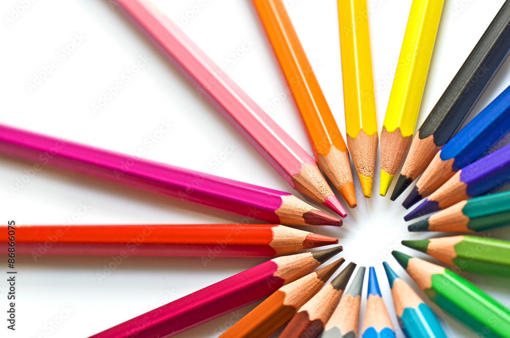 Circle of colorful wooden pencils isolated on white background